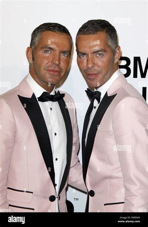 Fashion designers Dean Caten and Dan Caten arrive for amfAR's inaugural event at the Milan ...