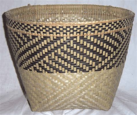 A poorly woven basket. Note the two distinctly different types of weave ...