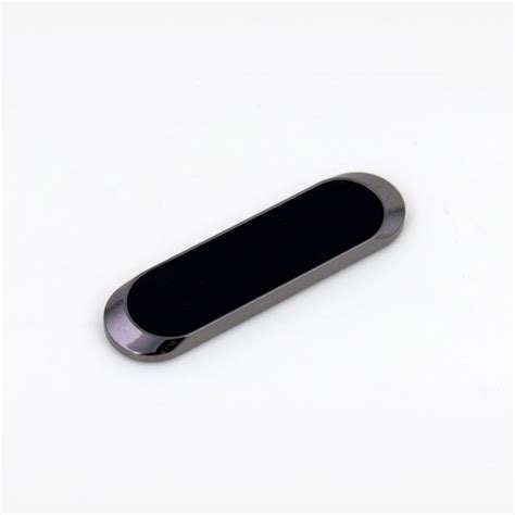 a black and silver object on a white surface
