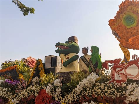 Surabaya - indonesia - 2023 - a parade vehicle with people on it in celebration of the 730th ...