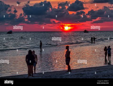 A sunset scene at a beach resort Stock Photo - Alamy