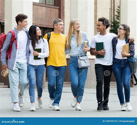 College Students Walking in Campus and Talking Outdoors Stock Image ...