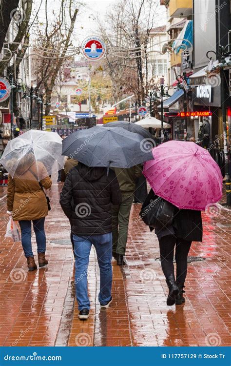 People walking in the rain editorial stock image. Image of maltepe ...