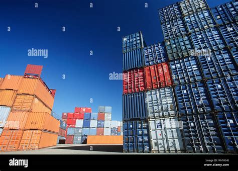 Shipping containers in storage yard Stock Photo - Alamy