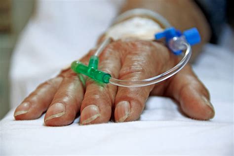 Iv Drip Injecting Human Arm Human Hand Stock Photos, Pictures & Royalty-Free Images - iStock