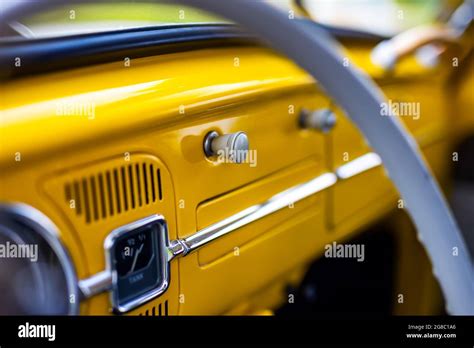 Restored yellow classic car interior. Photo taken in natural light Stock Photo - Alamy