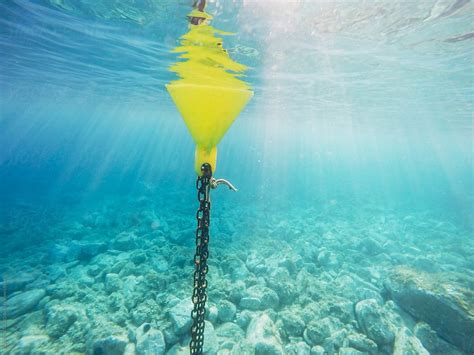 "Buoy Floating On A Mediterranean Sea." by Stocksy Contributor "BONNINSTUDIO " - Stocksy