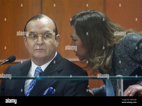 FILE - Vladimiro Montesinos, left, listens to his lawyer Estela Valdivia as he testifies at the ...