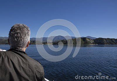 Senior Man Enjoys Wildlife Boat tour around Cachuma Lake. Thanks to the rainy season in ...