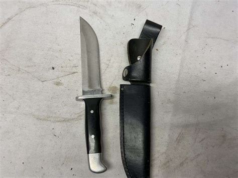 Buck 124 knife and sheath - Legacy Auction Company