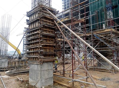 Timber column formwork under construction at the construction site — Stock Photo © Aisyaqilumar ...