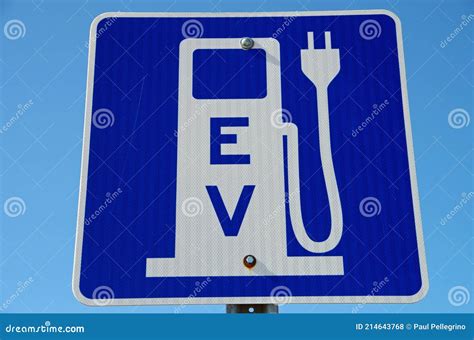 EV Charging Station Sign Against Blue Sky Stock Photo - Image of green, alternative: 214643768