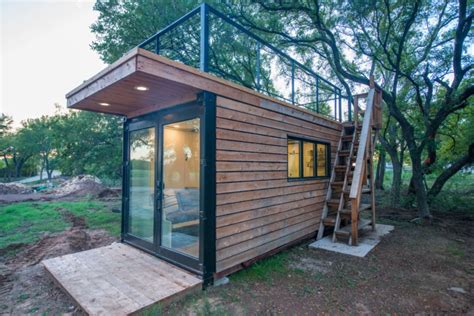 This tiny home with a rooftop deck is made from two shipping containers