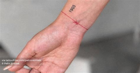 Minimalistic red wristband tattoo.