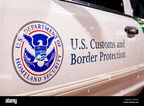 Customs and Border patrol logo on the side of the white patrol car Stock Photo - Alamy