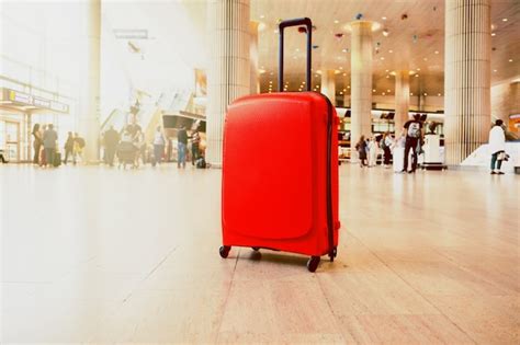 Premium Photo | Suitcase in airport terminal waiting area. traveling luggage in airport terminal.