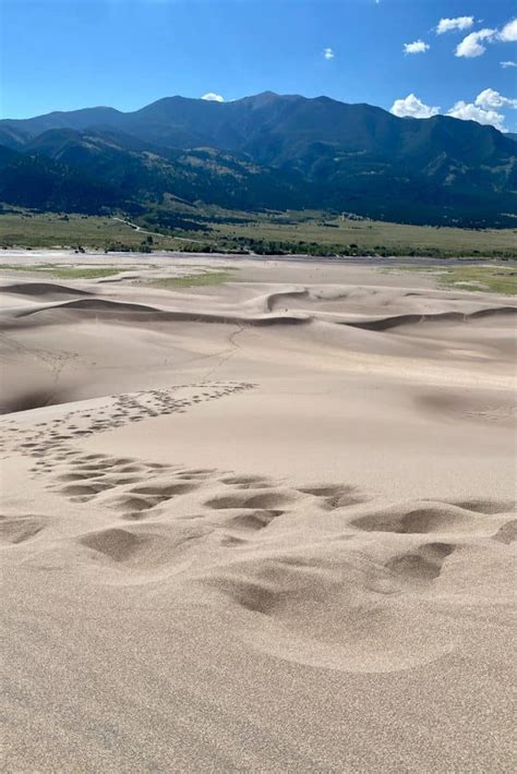 Sandboarding in Colorado (Great Sand Dunes) - Champagne Tastes®