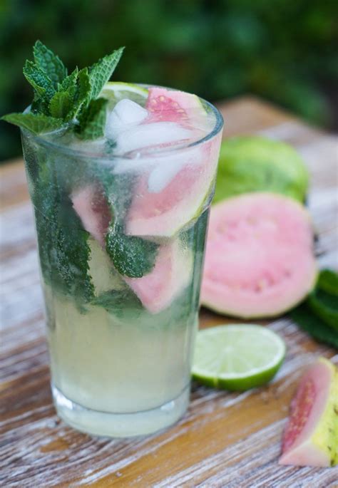 Sweet, refreshing Guava Mojito made with limes, guava nectar, rum and mint leaves. The perfect ...