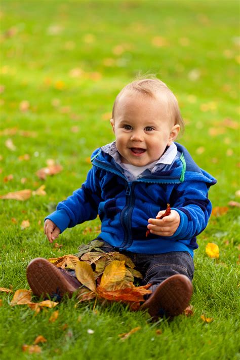 Baby Playing In Fall Free Stock Photo - Public Domain Pictures