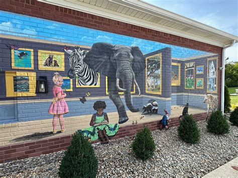 Characters in Her Books Painted on This Exterior Brick Wall