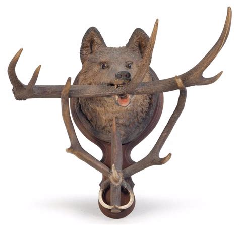 Carved bear head hat rack with antlers and wild boar tusks, late 19th century, 58 x 65x 42 cm ...