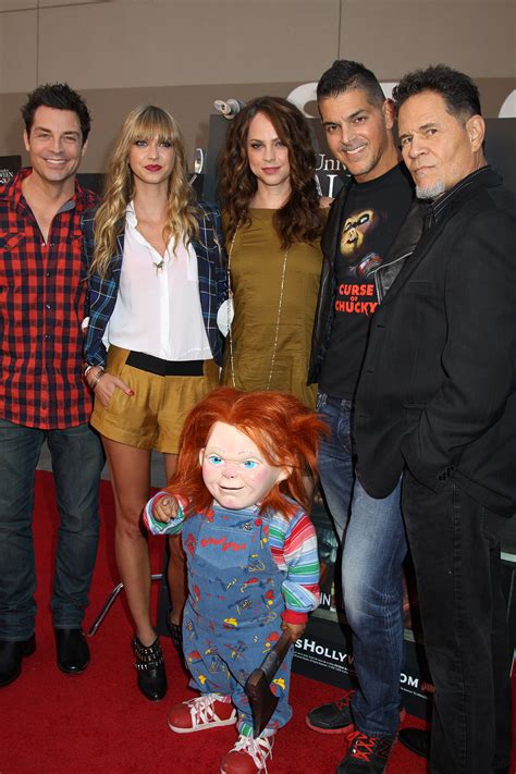 Chucky and the cast of Curse of Chucky L - R: Brennan Elliott, Maitland ...