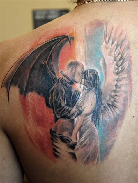 motivational red and blue color ink angel tattoo on boy back cover for ... | Devil tattoo, Demon ...