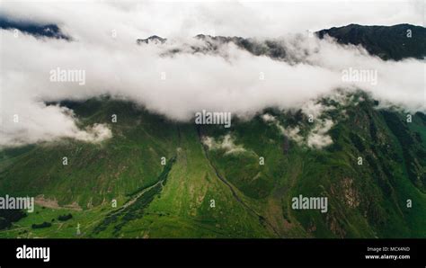 aerial view of green scenic mountains with clouds, Georgia Stock Photo ...