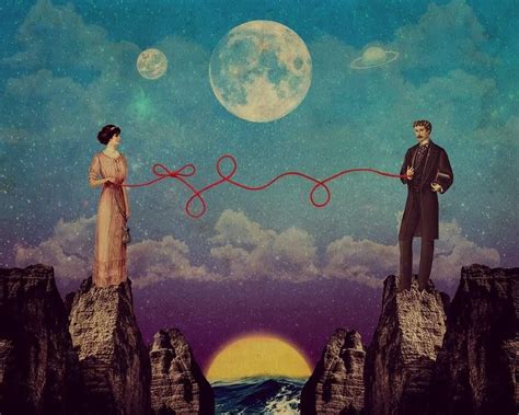 two people standing on top of rocks with ropes in front of them and the moon behind them