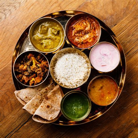 Indian food thali indianstyle meal containing chiken tikka, palak ...