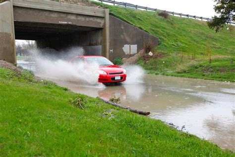 Car approaching high water with splashing | Red car entering… | Flickr