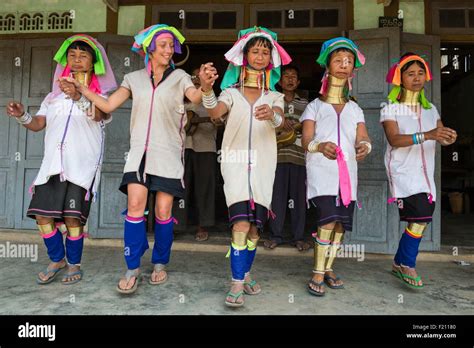 Myanmar (Burma), Kayah state, Kayan tribe (Padaung), Loikaw area, Kon Ta, tourist dancing with ...