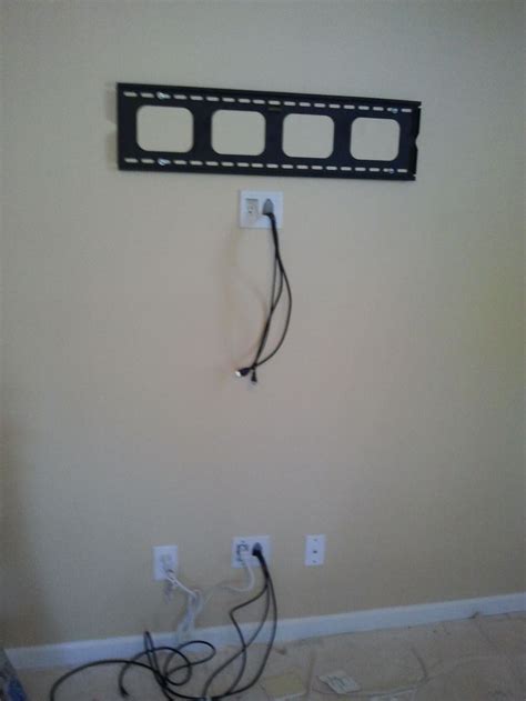 Concealing wires in the wall and extending the electrical outlet to the ...