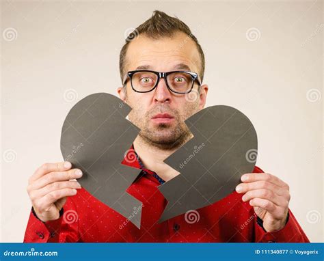 Sad man with broken heart. stock image. Image of heart - 111340877