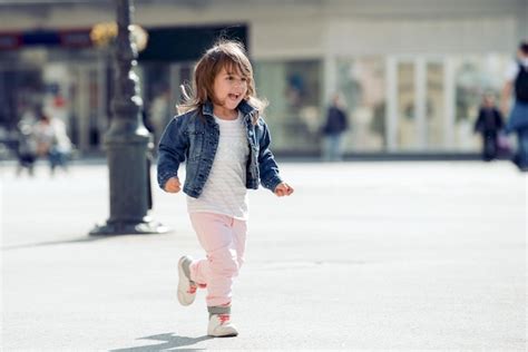 Premium Photo | Portrait of happy child playing outdoors