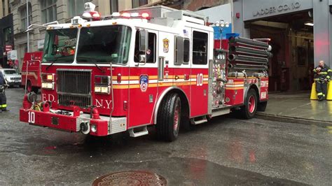 FDNY LADDER 10 & FDNY ENGINE 10 RETURNING TO QUARTERS ON LIBERTY ST. IN WALL ST. AREA OF ...