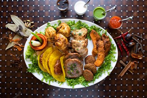 Premium Photo | Mixed kabab platter with seekh kabab tikka boti raita ...