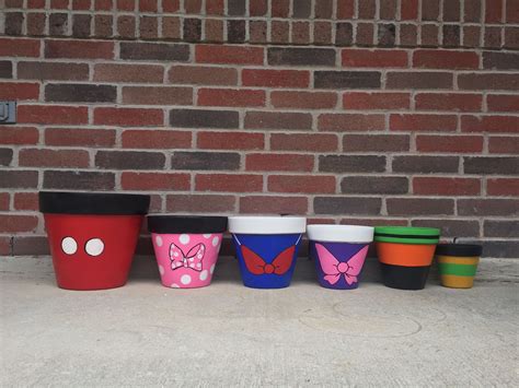 Disney Flower Pots by AngelWingsBSN | Flower pots, Diy crafts, Planter pots