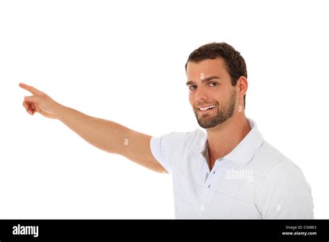 Smiling young guy pointing with finger. All on white background Stock Photo - Alamy