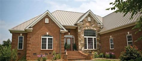 red brick house with metal roof - Hyo Elston