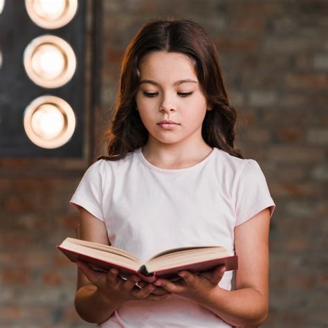 Free Photo | Serious pretty girl reading book