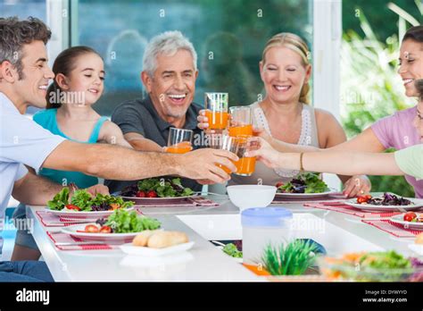 Family in big house Stock Photo - Alamy