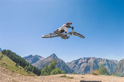 "Man Performing Midair Stunts With Mountain Bike" by Stocksy Contributor "Ibex.media" - Stocksy