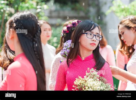 Hanoi, Vietnam - October 16, 2016. Group of female students dressed in formal clothing ...