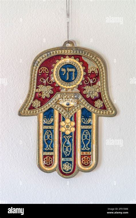 Jewish Hamsa or Khamsa - Hand of God, a middle eastern symbol for luck hanging off a wall Stock ...