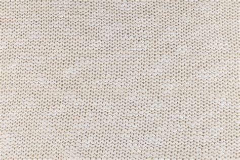 Premium Photo | Texture of natural ivory knitted fabric close-up. the background for your winter ...