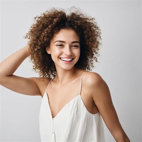 Premium AI Image | smiling girl with curly hair joyfully white studio background