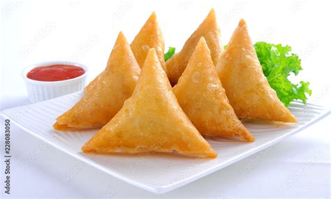 Samosa, Sambusa, Samboksa with a savory filling of chicken, mince, potato & vegetables Stock ...