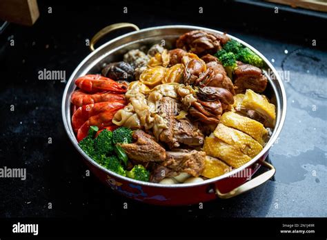 Chinese New Year food during Chinese New Year, assorted big Poon Choi Stock Photo - Alamy