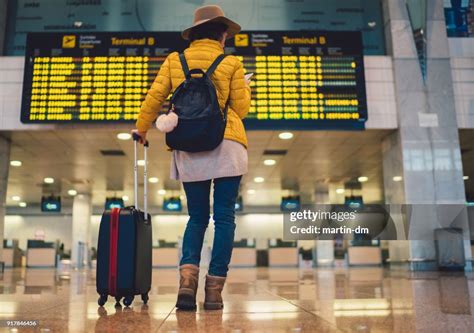 Tourist At Barcelona Airport Checking The Arrival Departure Board High-Res Stock Photo - Getty ...